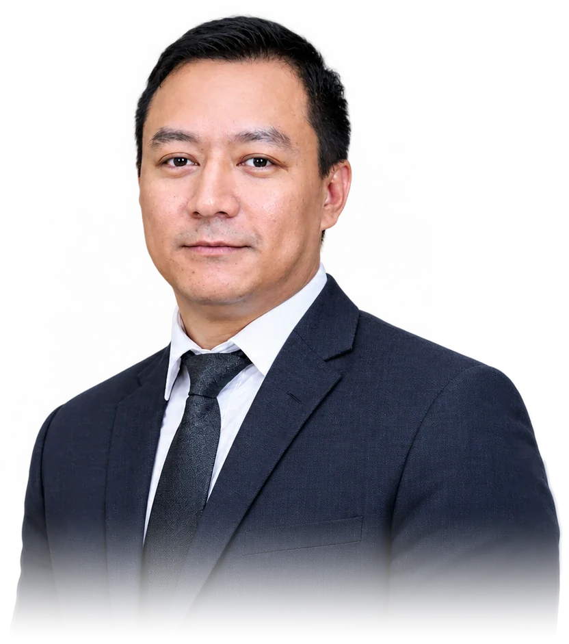 Portrait of Dinesh Thakali in a dark suit and tie